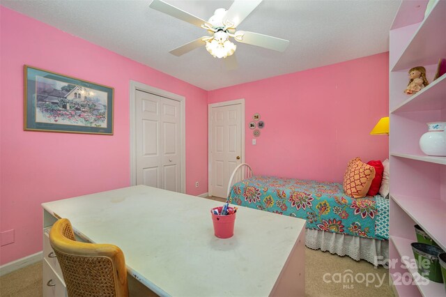 13416 Kintyre Ct, Matthews, NC 28105 - bedroom with light colored carpet, a ceiling fan, and a closet