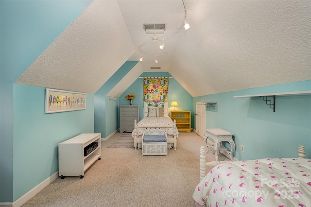 13416 Kintyre Ct, Matthews, NC 28105 - bedroom with a textured ceiling, vaulted ceiling, and carpet floors