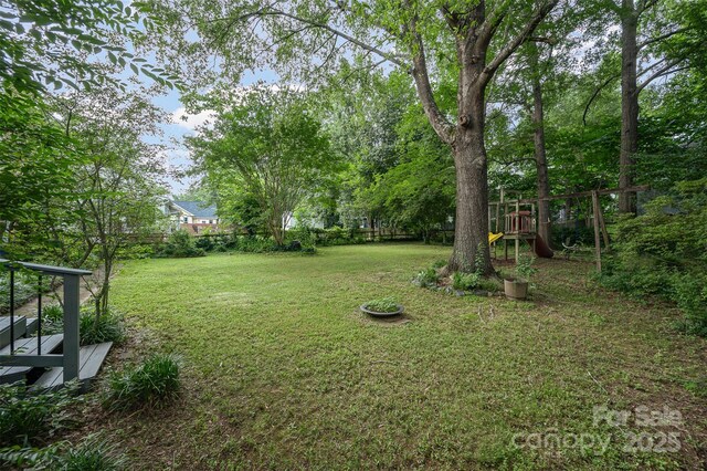 13416 Kintyre Ct, Matthews, NC 28105 - view of yard with a playground