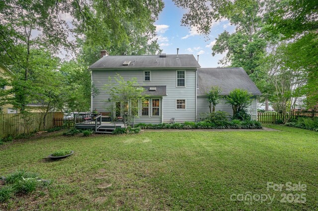 13416 Kintyre Ct, Matthews, NC 28105 - rear view of house with a wooden deck and a chimney