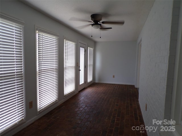833 21st Ave NE Unit 833, Hickory, NC 28601 - empty room with brick flooring and a ceiling fan