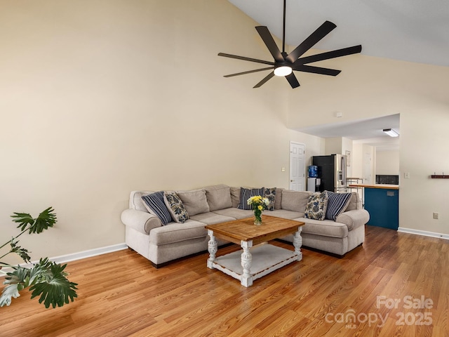 345 Bob Barnwell Rd, Fletcher, NC 28732 - living room featuring high vaulted ceiling, a ceiling fan, and light wood-style flooring