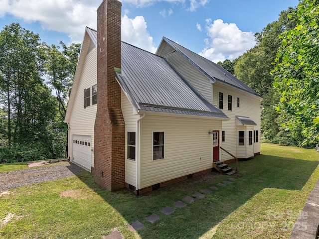 345 Bob Barnwell Rd, Fletcher, NC 28732 - view of property exterior featuring a chimney, entry steps, gravel driveway, a lawn, and a metal roof