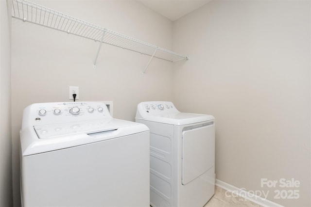 1117 Laurel Woods Dr, Gastonia, NC 28052 - laundry area with washing machine and clothes dryer and light tile patterned floors