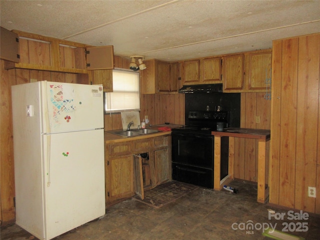 2927 S NC-16 Hwy, Newton, NC 28658 - kitchen featuring freestanding refrigerator, black electric range oven, wooden walls, extractor fan, and brown cabinetry