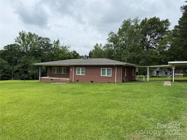 2350 Grubb Ferry Rd, Salisbury, NC 28144 - back of property with a porch, a lawn, crawl space, and brick siding