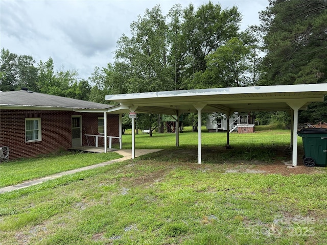 2350 Grubb Ferry Rd, Salisbury, NC 28144 - view of grassy yard with a detached carport