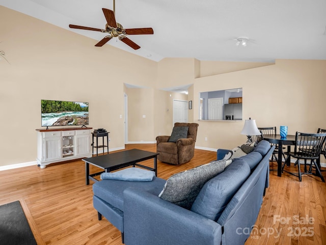 114 Fairway View Dr, Etowah, NC 28729 - living area with light wood-type flooring, ceiling fan, and high vaulted ceiling
