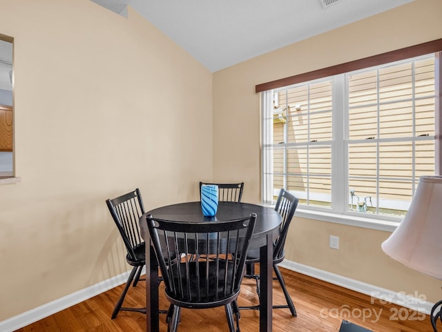 114 Fairway View Dr, Etowah, NC 28729 - dining space featuring wood finished floors and lofted ceiling