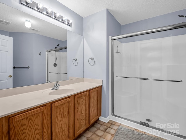 114 Fairway View Dr, Etowah, NC 28729 - full bath with a stall shower, vanity, and a textured ceiling