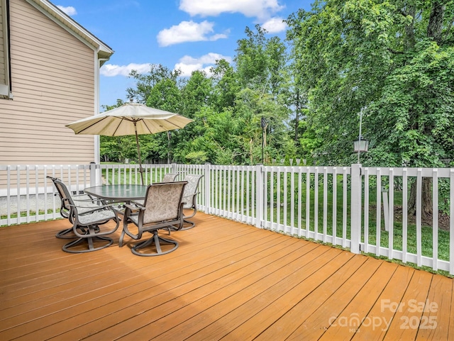 114 Fairway View Dr, Etowah, NC 28729 - wooden terrace with outdoor dining space and view of scattered trees
