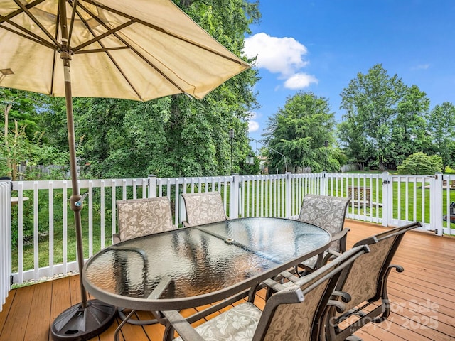 114 Fairway View Dr, Etowah, NC 28729 - wooden deck with outdoor dining area, a lawn, and view of scattered trees