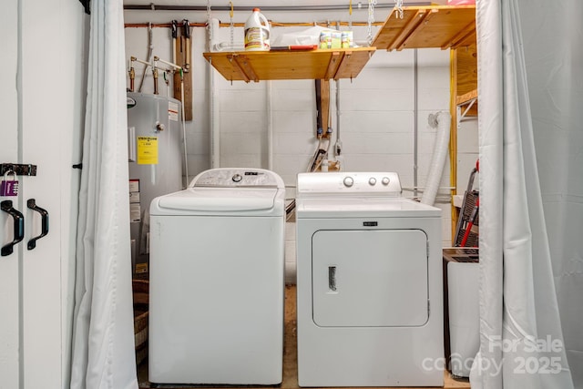 37 Poplar Dr, Rosman, NC 28772 - washroom featuring washing machine and clothes dryer, concrete block wall, and electric water heater