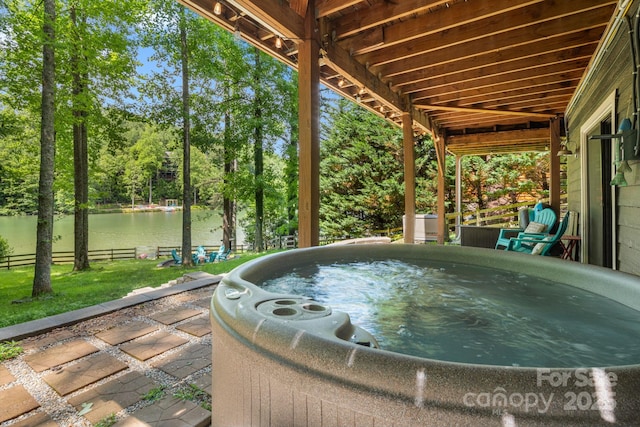 37 Poplar Dr, Rosman, NC 28772 - view of patio / terrace featuring a hot tub, a water view, and view of scattered trees