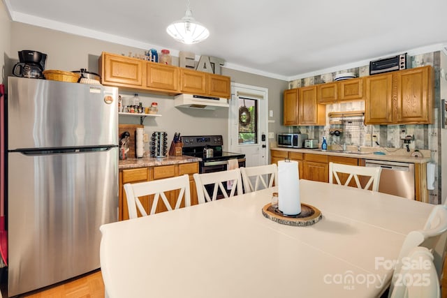 37 Poplar Dr, Rosman, NC 28772 - kitchen with appliances with stainless steel finishes, custom range hood, light countertops, tasteful backsplash, and hanging light fixtures