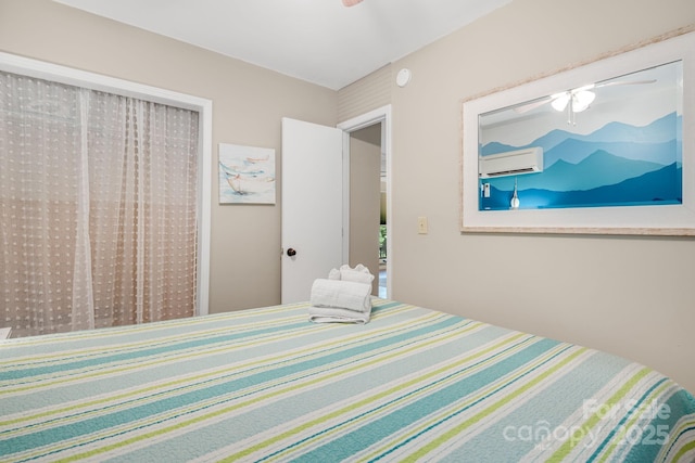 37 Poplar Dr, Rosman, NC 28772 - bedroom featuring a wall mounted AC and ceiling fan