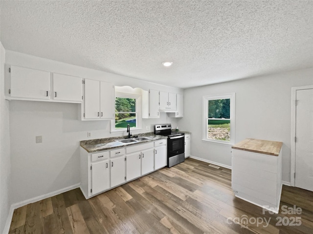 232 Branchwood Cir, Kings Mountain, NC 28086 - kitchen featuring stainless steel range with electric cooktop, a textured ceiling, white cabinetry, dark wood finished floors, and healthy amount of natural light