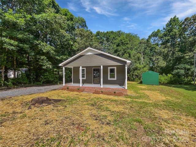232 Branchwood Cir, Kings Mountain, NC 28086 - bungalow-style home featuring a porch, a shed, and a front lawn