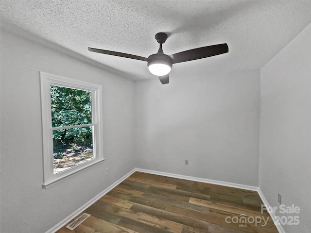 232 Branchwood Cir, Kings Mountain, NC 28086 - unfurnished room with dark wood-style flooring, a ceiling fan, and a textured ceiling