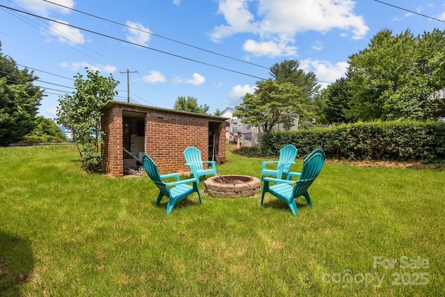 2 Enka Orchard St Unit 21A, Candler, NC 28715 - view of green lawn with a fire pit and an outdoor structure
