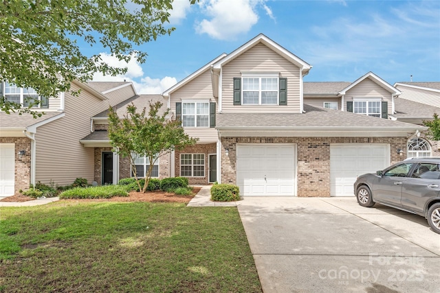12452 Stratfield Place Cir, Pineville, NC 28134 - multi unit property with driveway, brick siding, a front yard, and a shingled roof