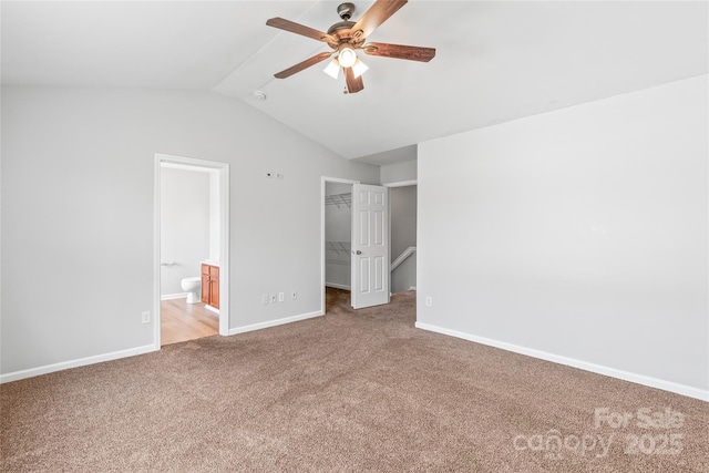 12452 Stratfield Place Cir, Pineville, NC 28134 - unfurnished bedroom featuring carpet floors, lofted ceiling, a walk in closet, a closet, and ensuite bath