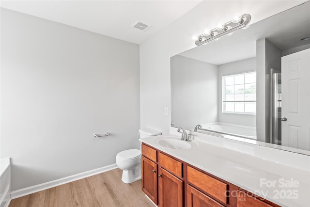 12452 Stratfield Place Cir, Pineville, NC 28134 - full bathroom featuring a bath, wood finished floors, and vanity