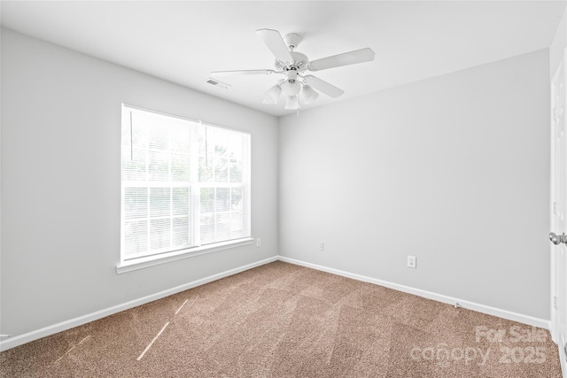12452 Stratfield Place Cir, Pineville, NC 28134 - carpeted spare room with baseboards and a ceiling fan