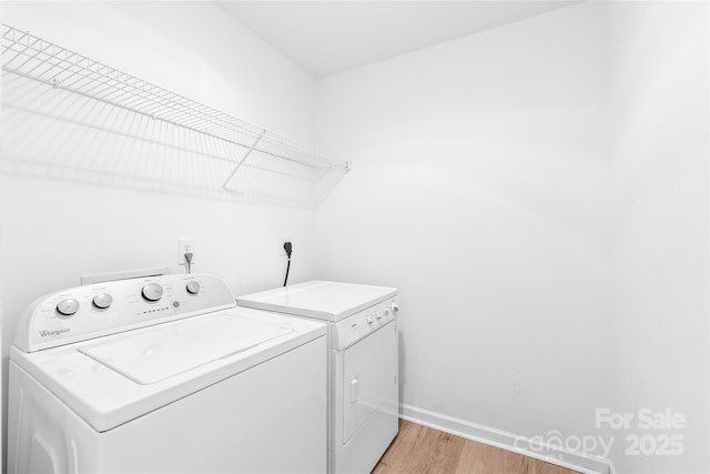 12452 Stratfield Place Cir, Pineville, NC 28134 - laundry area featuring separate washer and dryer and light wood-style flooring