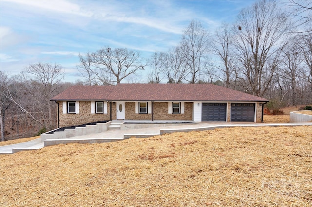 238 Lincoln Dr, Forest City, NC 28043 - single story home featuring a garage, a porch, brick siding, and concrete driveway