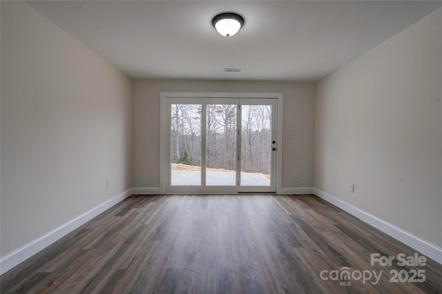 238 Lincoln Dr, Forest City, NC 28043 - spare room with dark wood-style flooring and baseboards