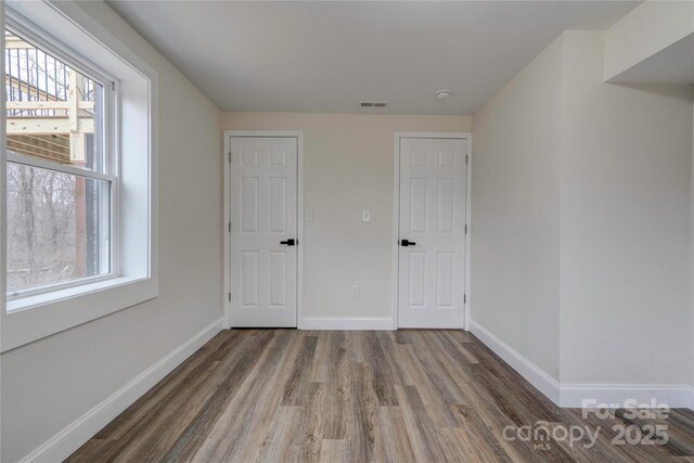 238 Lincoln Dr, Forest City, NC 28043 - unfurnished bedroom featuring wood finished floors