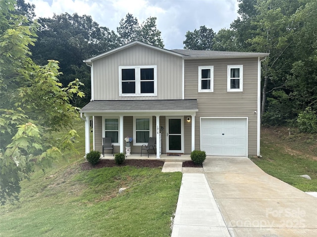1916 Country Way, Hickory, NC 28601 - traditional home with covered porch, driveway, a front lawn, an attached garage, and board and batten siding