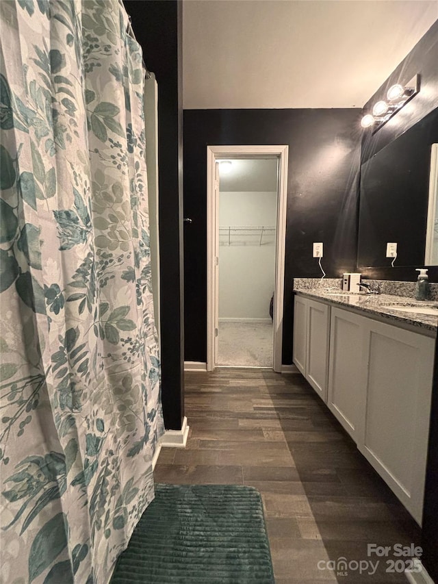 1916 Country Way, Hickory, NC 28601 - bathroom with wood finished floors, double vanity, and a spacious closet