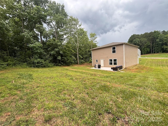 1916 Country Way, Hickory, NC 28601 - view of grassy yard with a patio area and a forest view