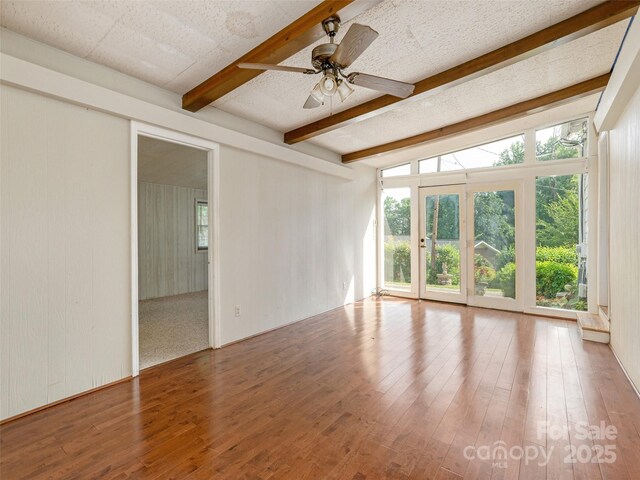 34 Lockhart Rd, Tryon, NC 28782 - empty room featuring beamed ceiling, wood finished floors, a ceiling fan, and wood walls
