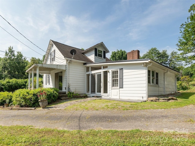 34 Lockhart Rd, Tryon, NC 28782 - view of front of house featuring a chimney