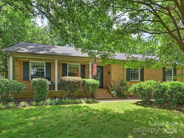 5211 Londonderry Rd, Charlotte, NC 28210 - ranch-style house featuring a front lawn, brick siding, and roof with shingles