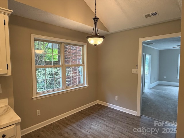 4402 Poxon Ln, Monroe, NC 28110 - unfurnished dining area featuring lofted ceiling and dark wood-style floors