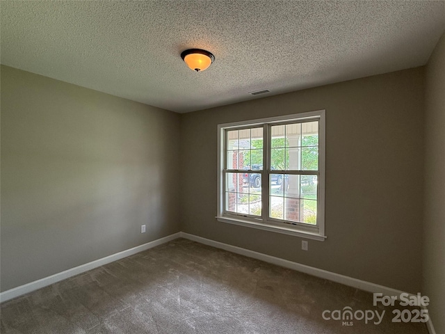 4402 Poxon Ln, Monroe, NC 28110 - carpeted spare room with baseboards and a textured ceiling