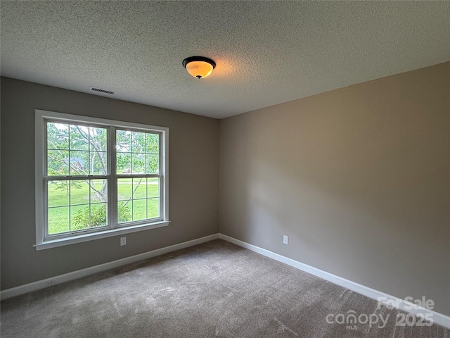 4402 Poxon Ln, Monroe, NC 28110 - carpeted empty room with baseboards and a textured ceiling