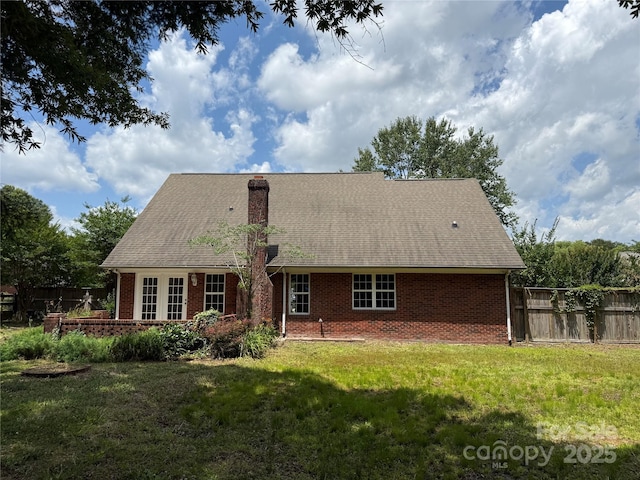 4402 Poxon Ln, Monroe, NC 28110 - rear view of property featuring brick siding, a chimney, and a shingled roof