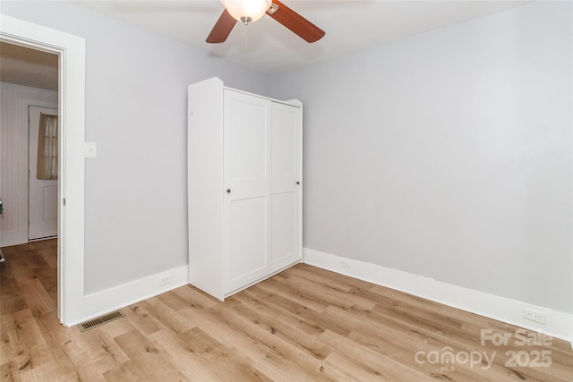 13414 Central Ave, Huntersville, NC 28078 - unfurnished bedroom featuring light wood-type flooring and a ceiling fan