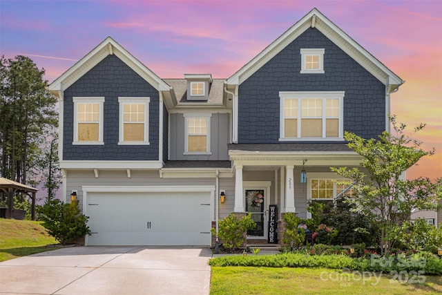 205 Falls Cove Dr, Troutman, NC 28166 - view of front of house with driveway, a garage, and covered porch
