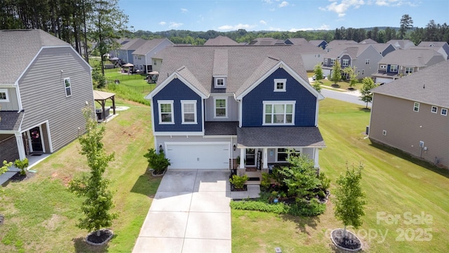 205 Falls Cove Dr, Troutman, NC 28166 - view of front of home featuring a residential view, driveway, an attached garage, and a front lawn