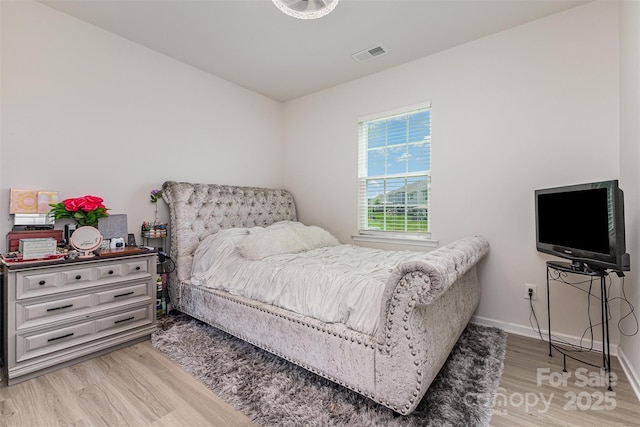 205 Falls Cove Dr, Troutman, NC 28166 - bedroom featuring light wood-style flooring and baseboards