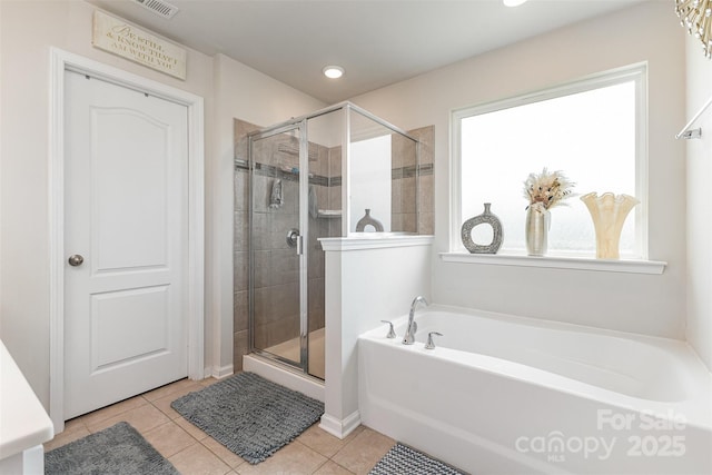 205 Falls Cove Dr, Troutman, NC 28166 - full bathroom with plenty of natural light, a garden tub, and a stall shower