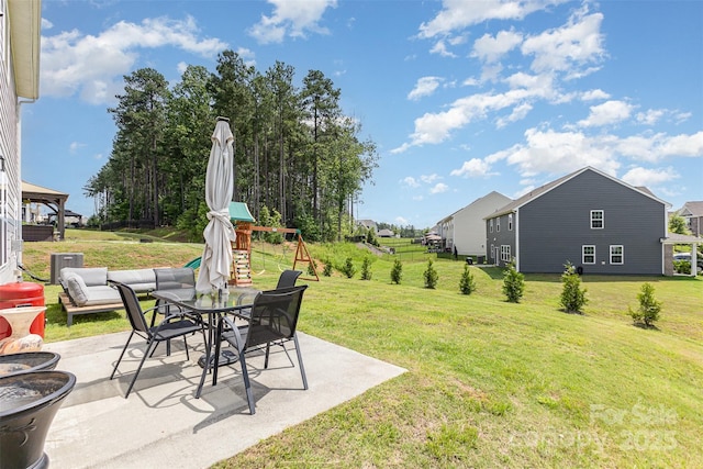205 Falls Cove Dr, Troutman, NC 28166 - view of green lawn with a patio and a playground