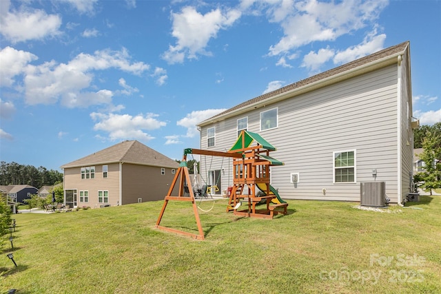 205 Falls Cove Dr, Troutman, NC 28166 - back of property featuring a playground and a yard