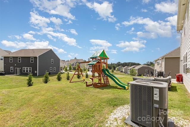 205 Falls Cove Dr, Troutman, NC 28166 - view of green lawn featuring a residential view and a playground